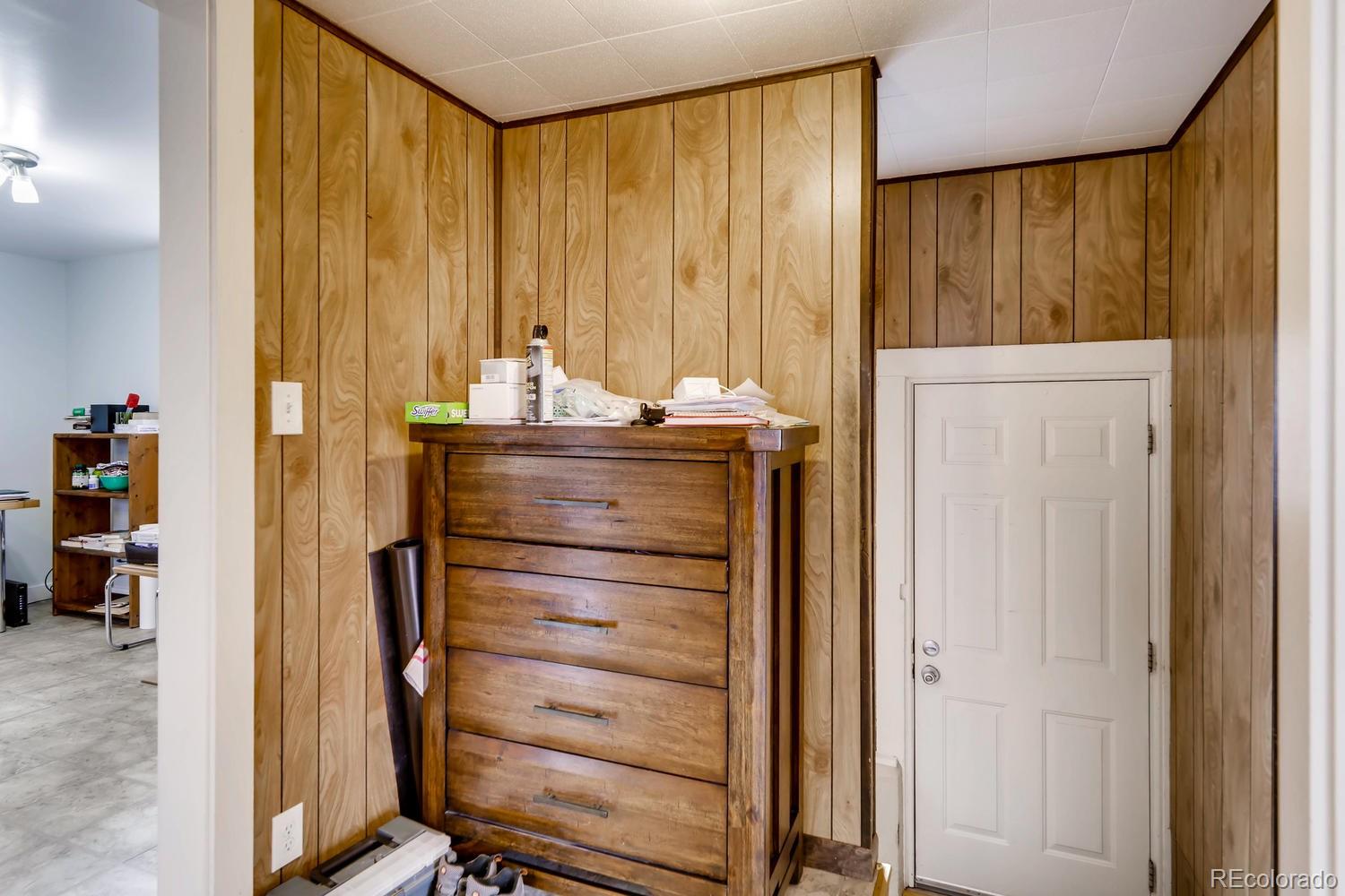 4445 Perry Street Denver, CO 80212 - Photo 15 of 19 a view of walk in closet with clothes