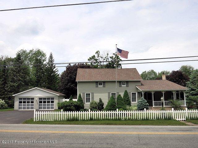 3441 Madisonville Road Moscow, PA 18444 - Photo 1 of 28 a front view of a house with a fence