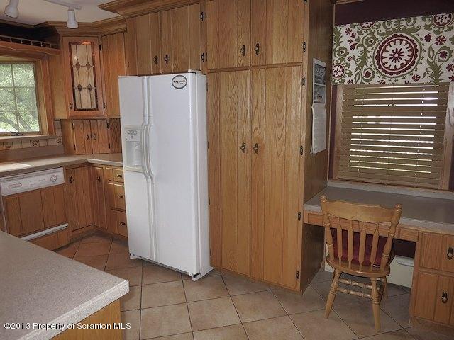 3441 Madisonville Road Moscow, PA 18444 - Photo 11 of 28 a white refrigerator freezer sitting in a kitchen