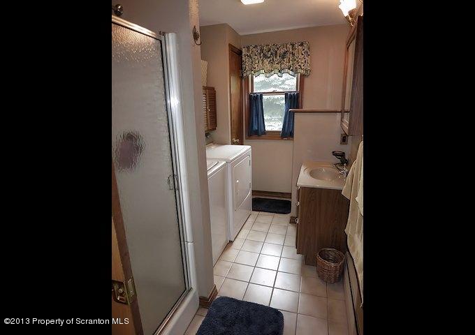 3441 Madisonville Road Moscow, PA 18444 - Photo 12 of 28 a bathroom with a sink toilet and shower