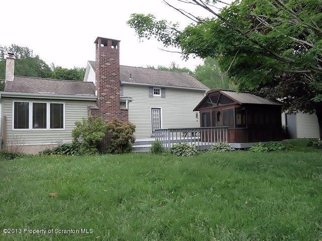 3441 Madisonville Road Moscow, PA 18444 - Photo 22 of 28 a view of a house with a big yard and large trees