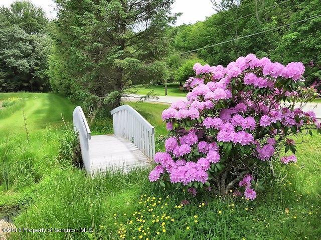3441 Madisonville Road Moscow, PA 18444 - Photo 27 of 28 a view of yard with beautiful flowers and flowers