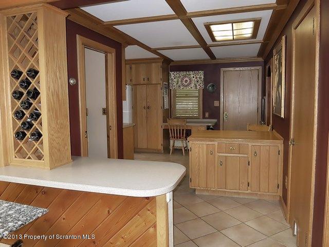 3441 Madisonville Road Moscow, PA 18444 - Photo 8 of 28 a kitchen with cabinets and window