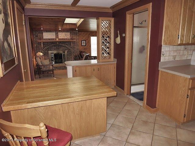 3441 Madisonville Road Moscow, PA 18444 - Photo 9 of 28 a kitchen with a sink a refrigerator and cabinets