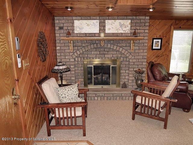 3441 Madisonville Road Moscow, PA 18444 - Photo 10 of 28 a living room with furniture and a fireplace