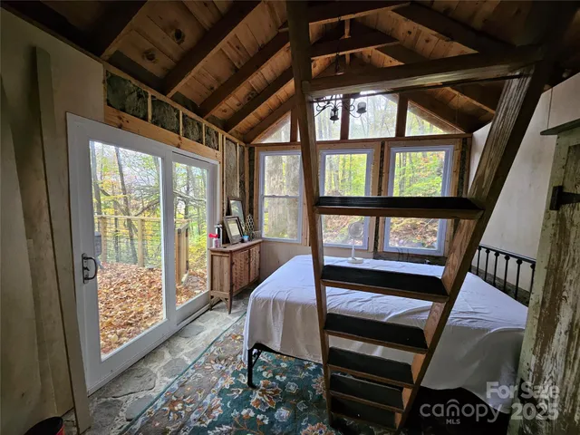 a kitchen with a stove a sink and wooden cabinets