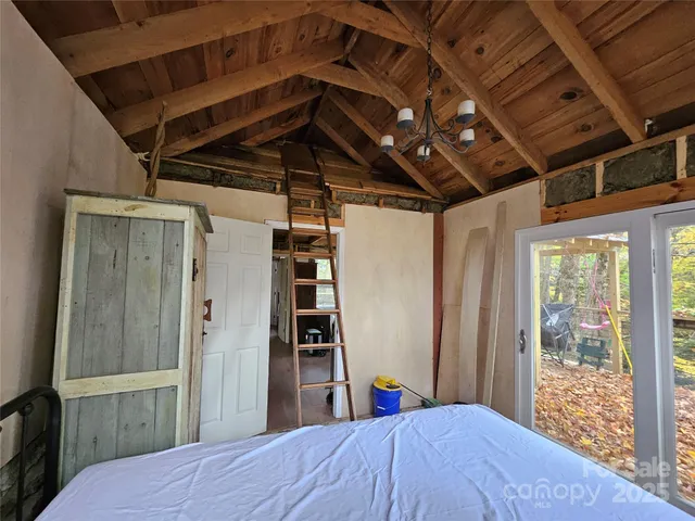 a kitchen with sink wooden floor and next to a window