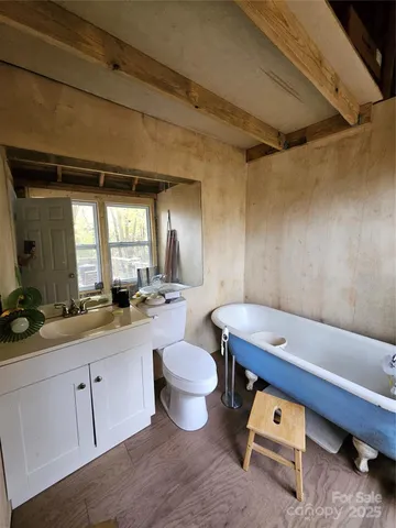 a kitchen with stainless steel appliances granite countertop a sink a refrigerator and a stove