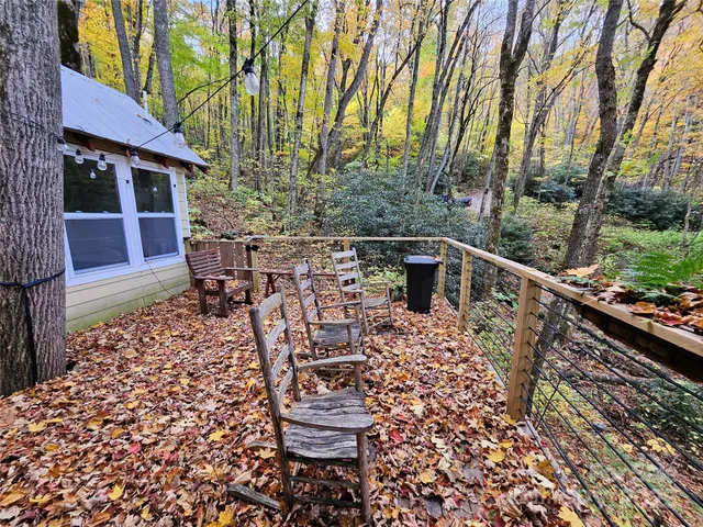 a view of a chairs and table in the balcony