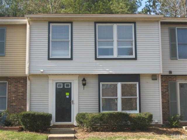 7727 Bernadette Lane Raleigh, NC 27615 - Photo 1 of 7 a front view of a house with a yard