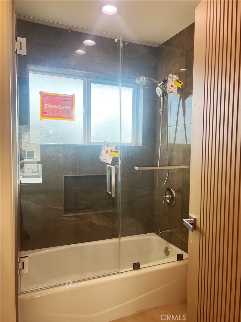 1514 East Woodbury Road, Unit 1/2 Pasadena, CA 91104 - Photo 11 of 14 a bathroom with a bathtub and shower