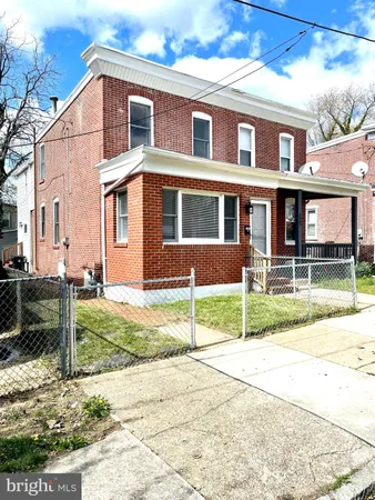 a view of house with yard