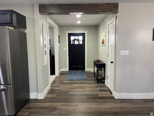 558 North N Cres Road Roosevelt, UT 84066 - Photo 24 of 31 Entryway featuring wood-finish flooring, a dark wood beam, recessed lighting, white baseboards, and a black front door with decorative glass inserts