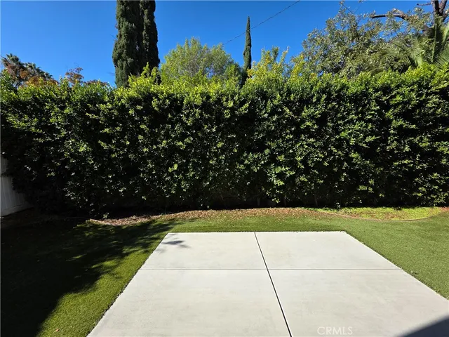 a view of backyard with garden and entertaining space