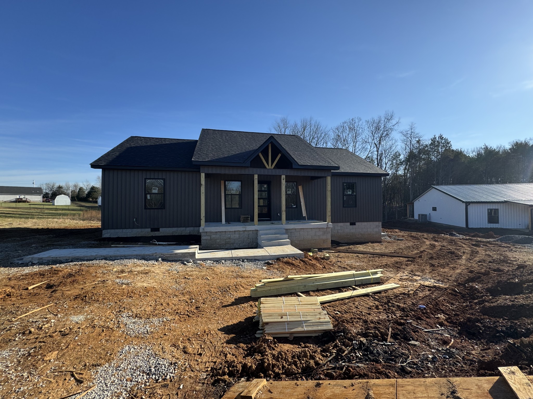 3859 Rivy Way Lewisburg, TN 37091 - Photo 4 of 15 a front view of a house with a yard covered with snow