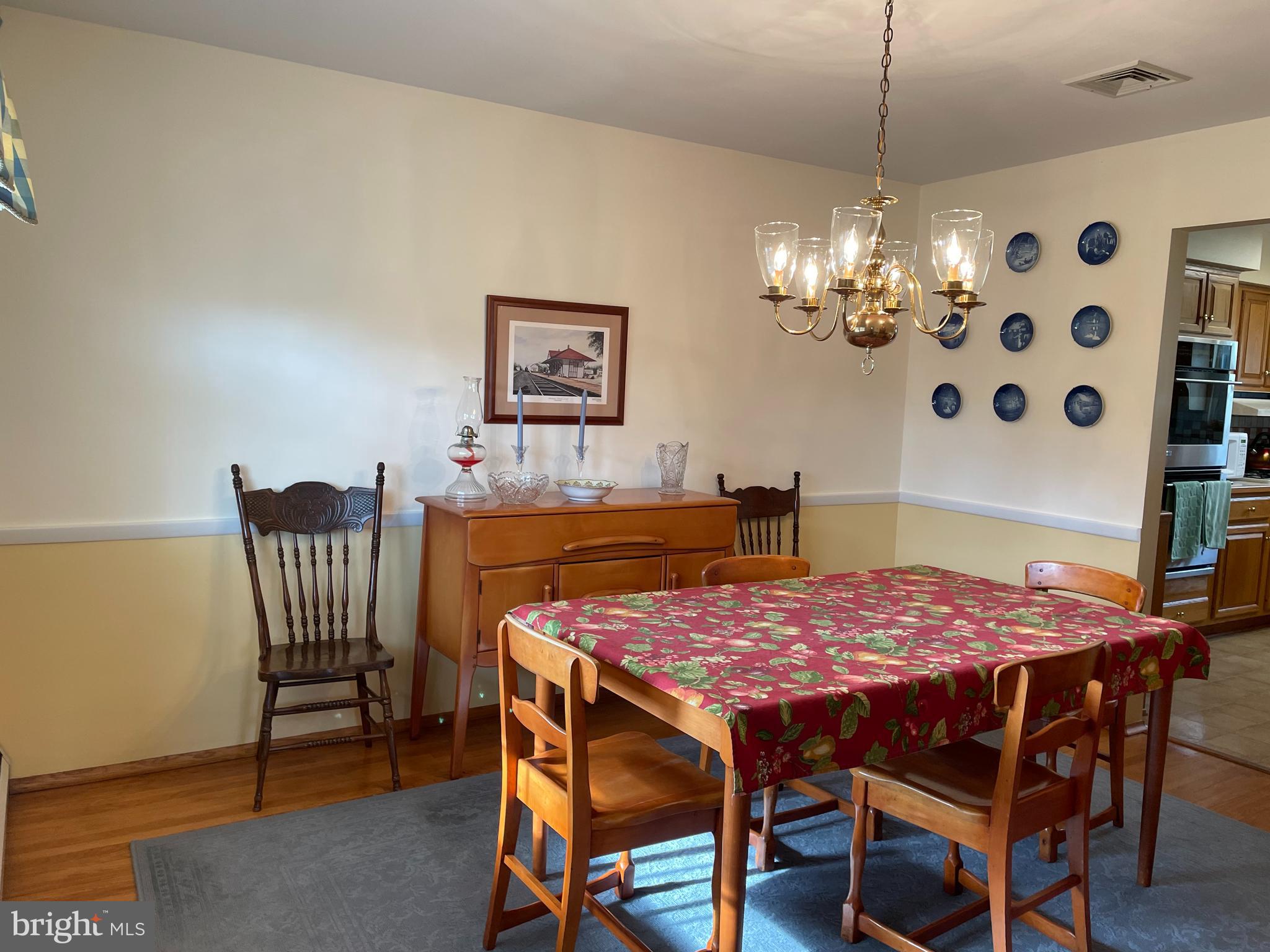 2535 Exton Road Hatboro, PA 19040 - Photo 5 of 19 a dining room with furniture a chandelier and wooden floor