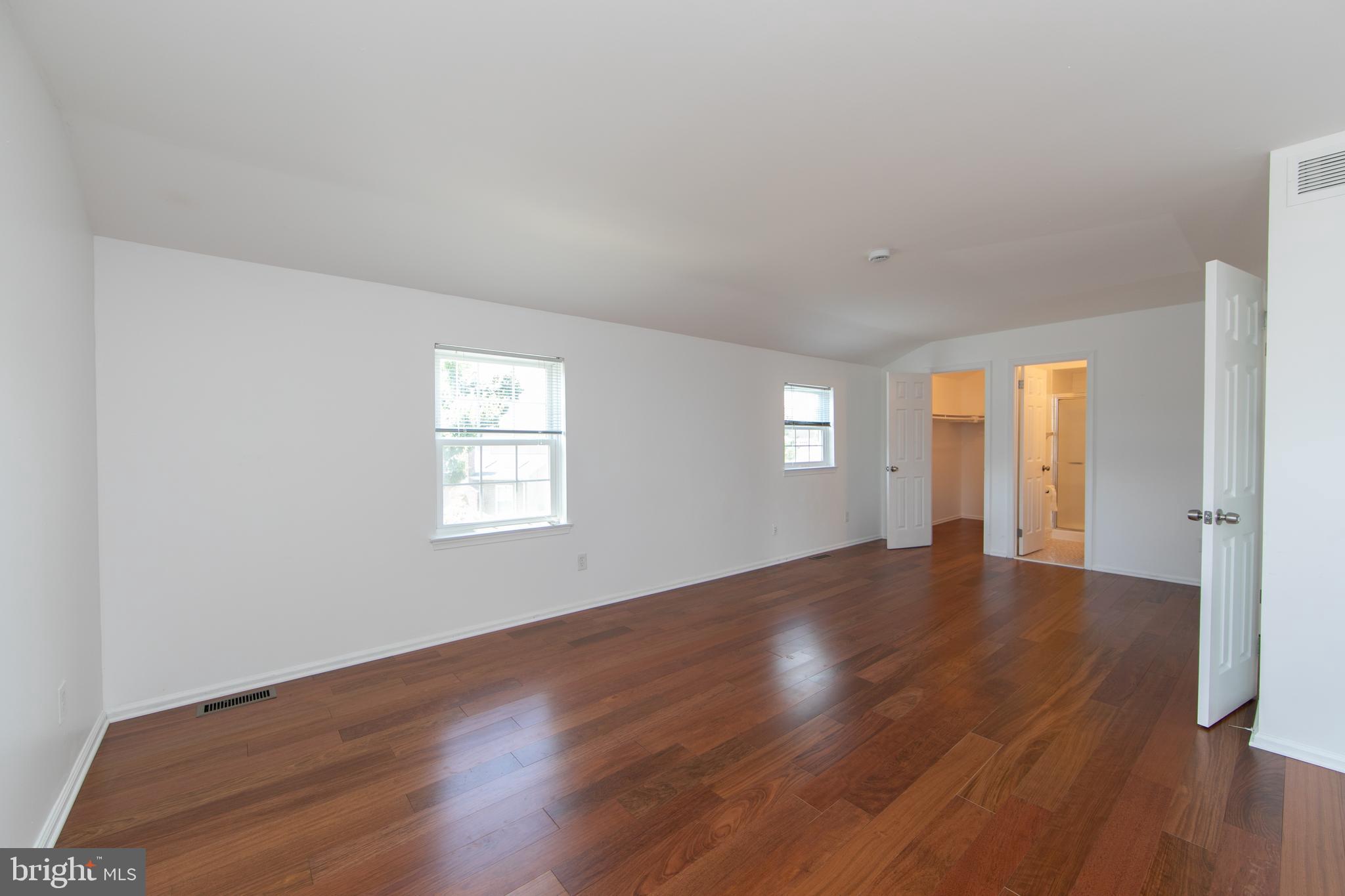 3007 Rampart Road Bensalem, PA 19020 - Photo 28 of 48 an empty room with wooden floor and windows