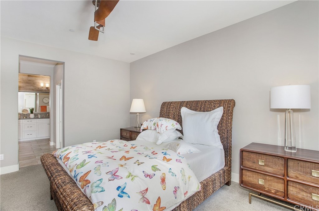 72 Capricorn Irvine, CA 92618 - Photo 15 of 24 a bedroom with a bed and lamp