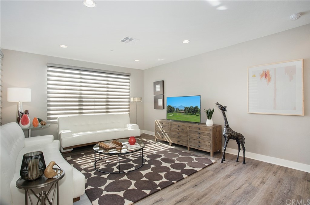 72 Capricorn Irvine, CA 92618 - Photo 7 of 24 a bedroom with furniture and a window