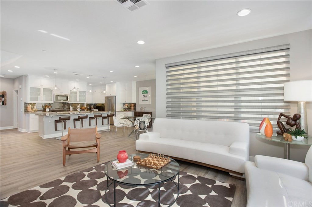 72 Capricorn Irvine, CA 92618 - Photo 8 of 24 a living room with furniture and a large window
