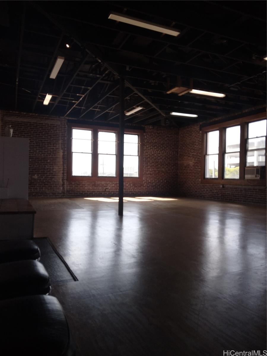186 North King Street, Unit A Honolulu, HI 96817 - Photo 2 of 4 a view of a room with lots of wooden floor