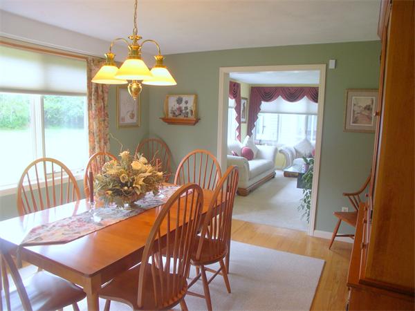 9 Garvey Road Framingham, MA 01701 - Photo 13 of 30 a dining room with furniture a chandelier and wooden floor
