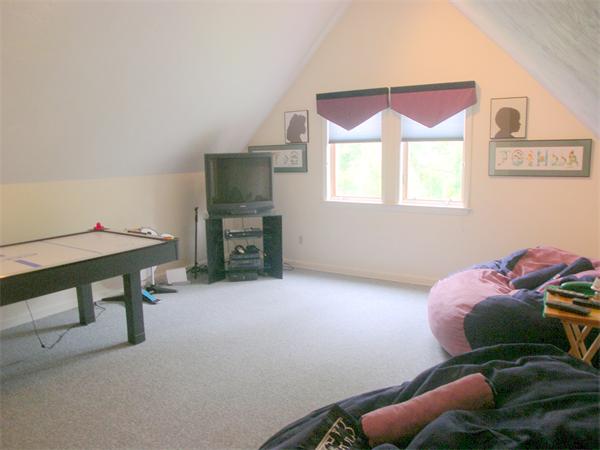 9 Garvey Road Framingham, MA 01701 - Photo 18 of 30 a living room with furniture and a fireplace