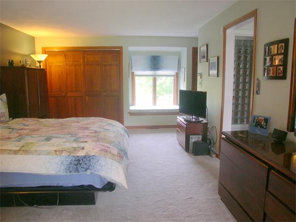 9 Garvey Road Framingham, MA 01701 - Photo 19 of 30 a spacious bedroom with a bed and a window