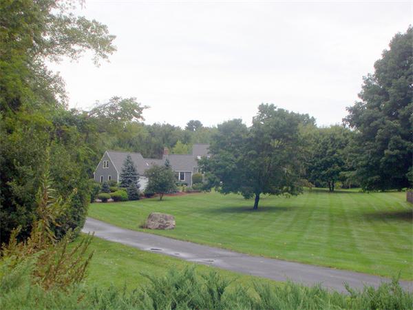 9 Garvey Road Framingham, MA 01701 - Photo 2 of 30 a view of a park with large trees
