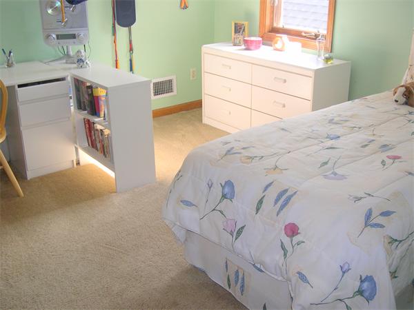 9 Garvey Road Framingham, MA 01701 - Photo 25 of 30 a bedroom with a bed and a cabinets