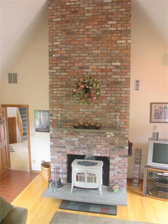 9 Garvey Road Framingham, MA 01701 - Photo 9 of 30 a living room with furniture and fireplace