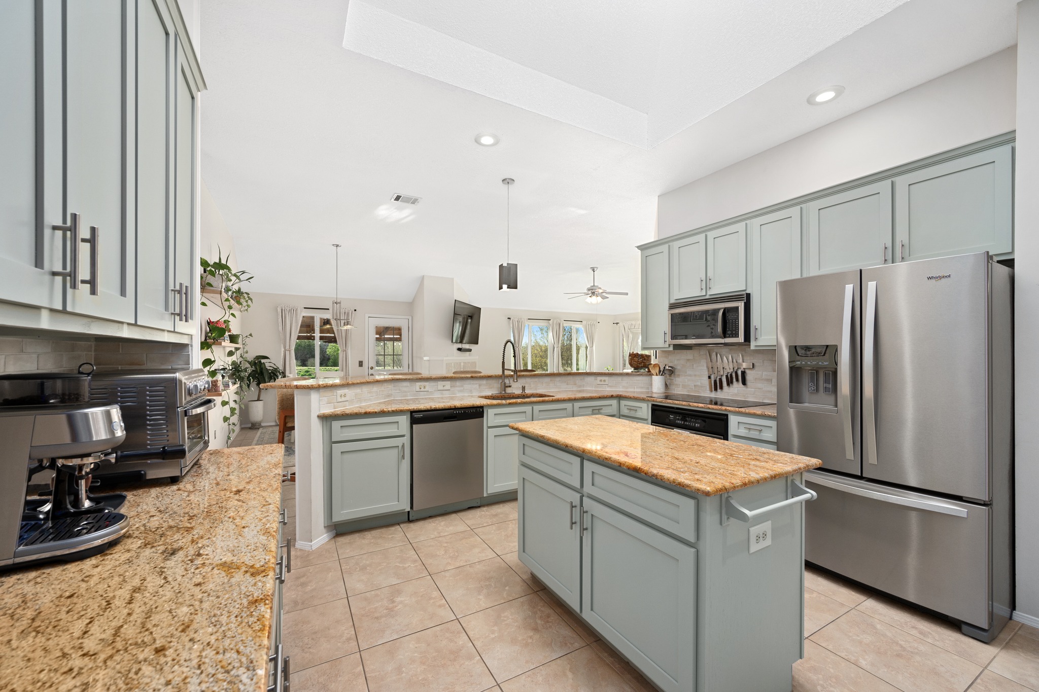 7601 Ponoma Trail Austin, TX 78749 - Photo 13 of 38 a kitchen with a refrigerator a stove top oven and a sink