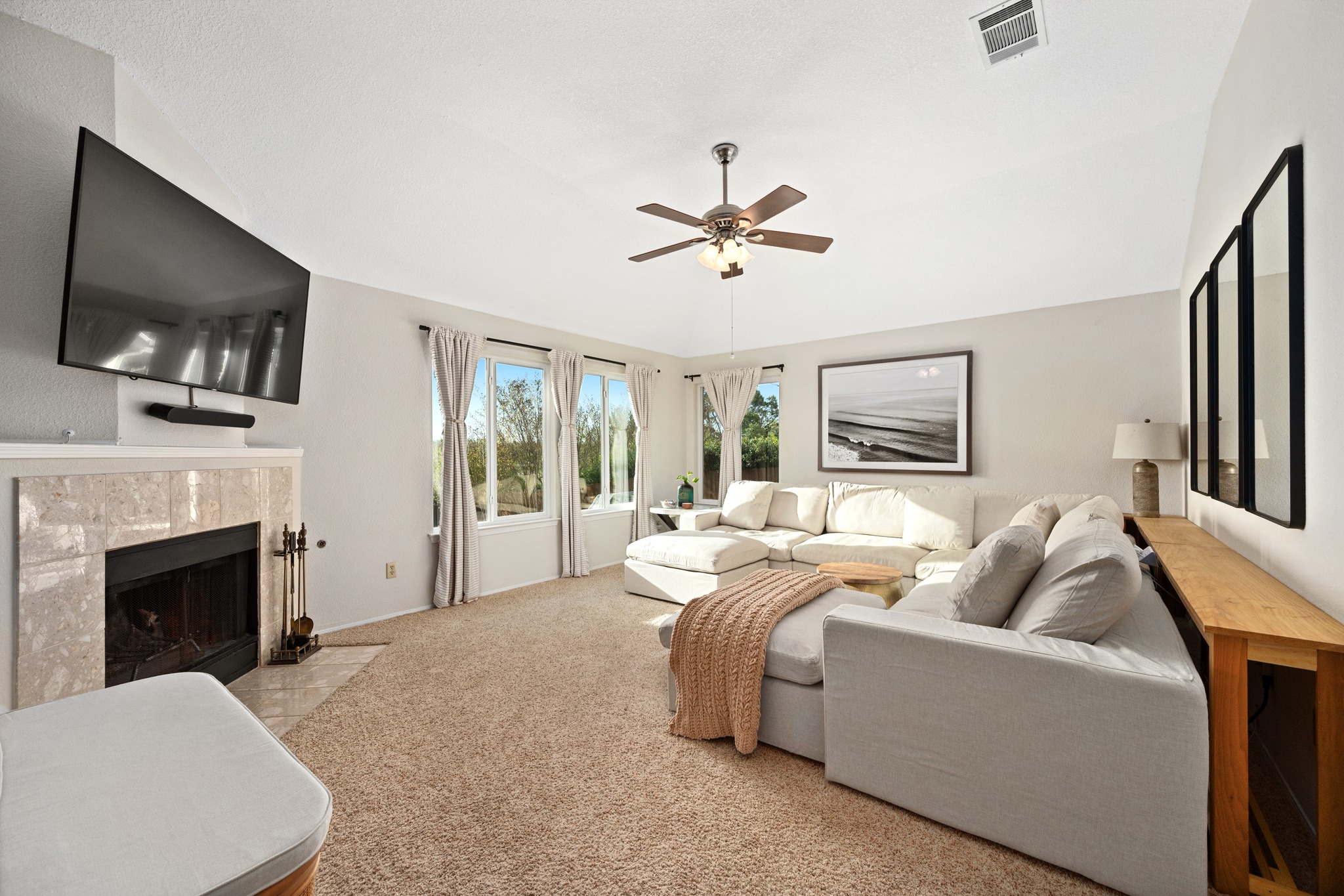 7601 Ponoma Trail Austin, TX 78749 - Photo 20 of 38 a living room with furniture a flat screen tv and a fireplace