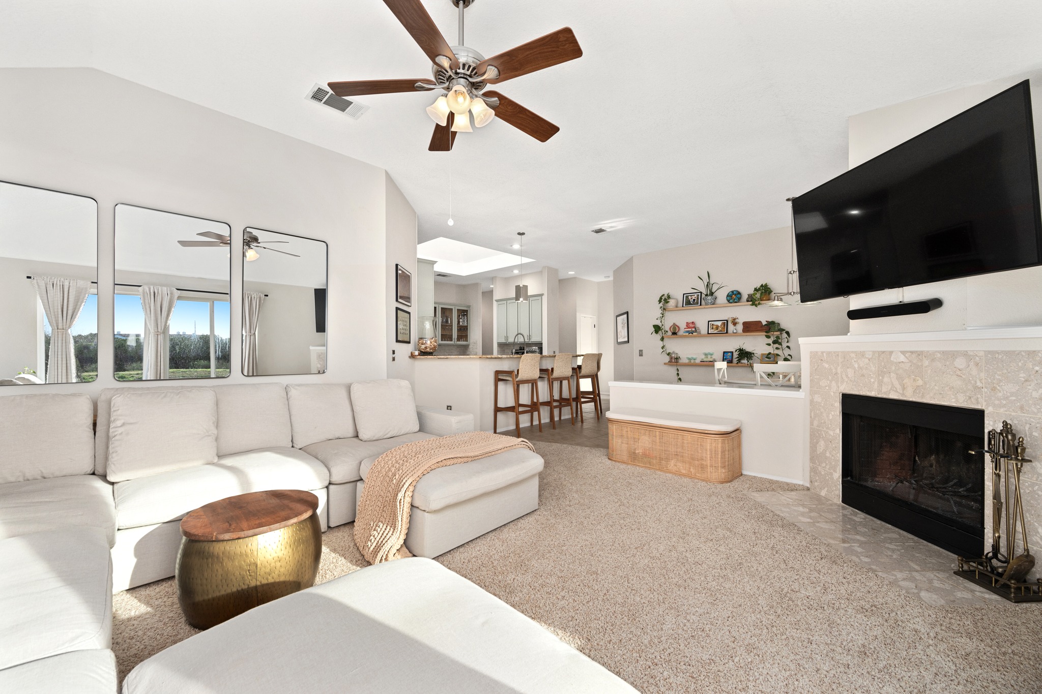 7601 Ponoma Trail Austin, TX 78749 - Photo 21 of 38 a living room with furniture a flat screen tv and a fireplace