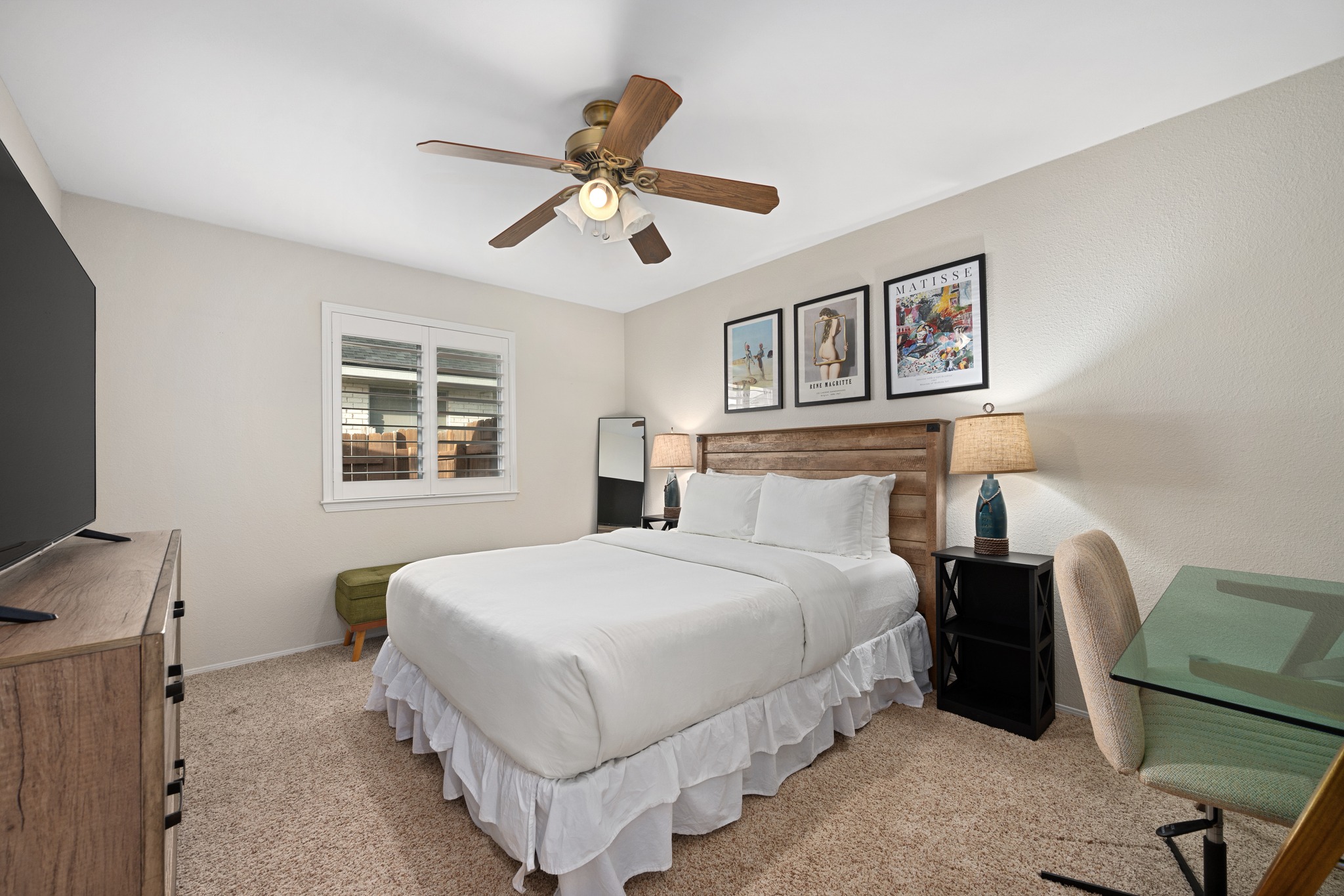7601 Ponoma Trail Austin, TX 78749 - Photo 27 of 38 a bedroom with a bed next to a window with a flat screen tv and dresser