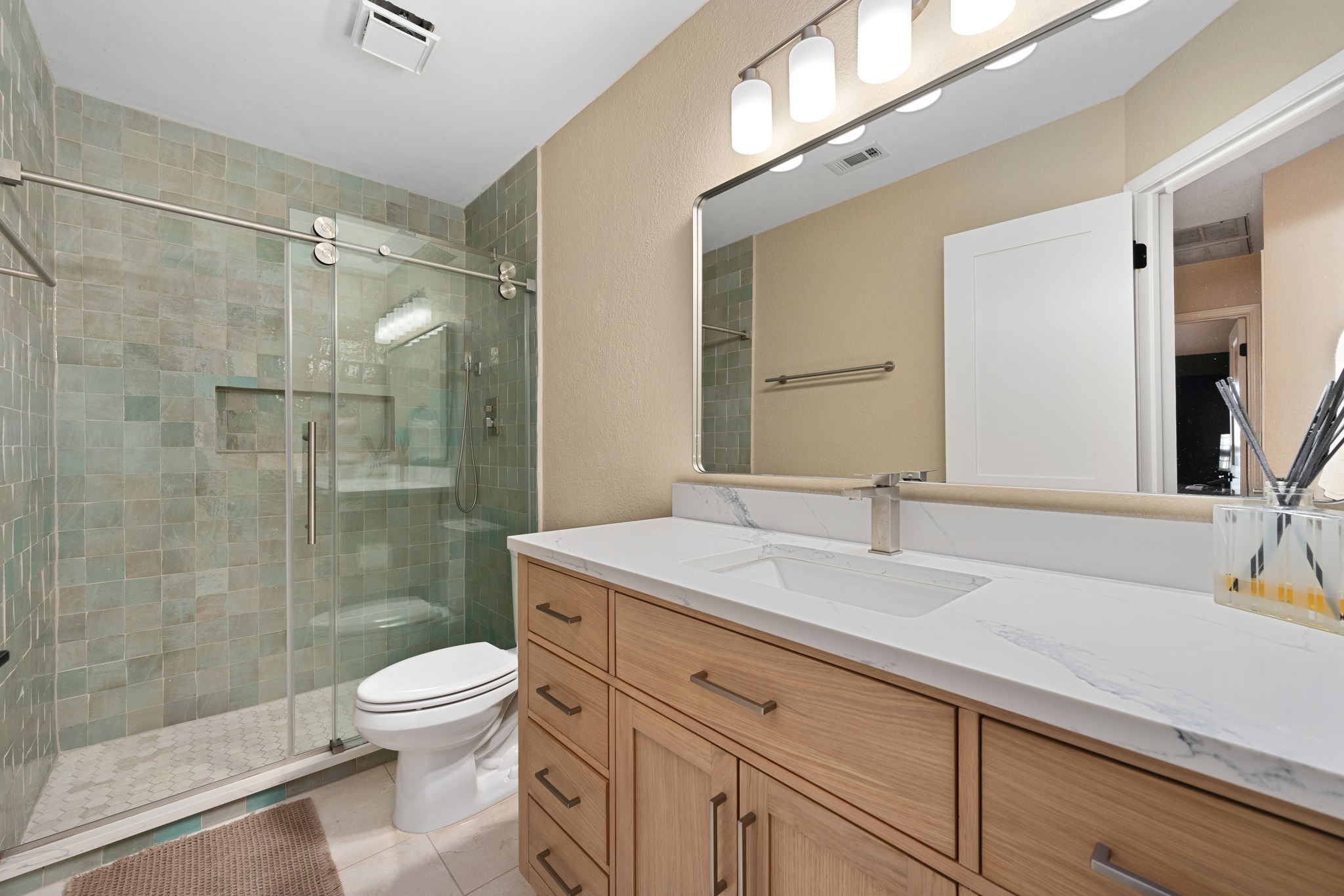 7601 Ponoma Trail Austin, TX 78749 - Photo 28 of 38 a bathroom with a shower sink vanity mirror and toilet