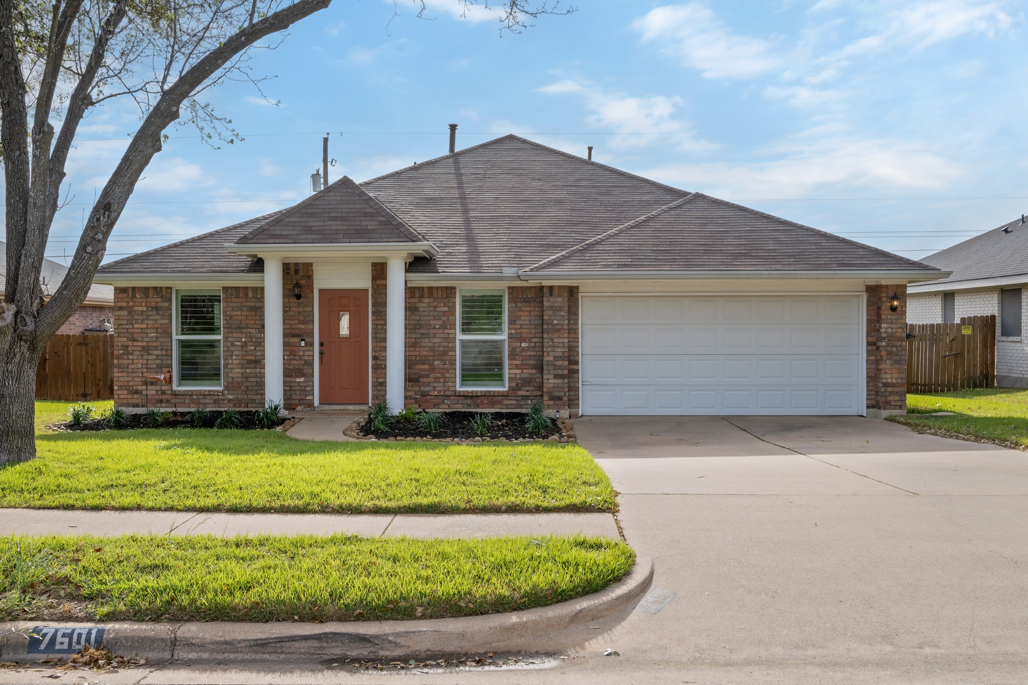 7601 Ponoma Trail Austin, TX 78749 - Photo 5 of 38 a front view of a house with a yard