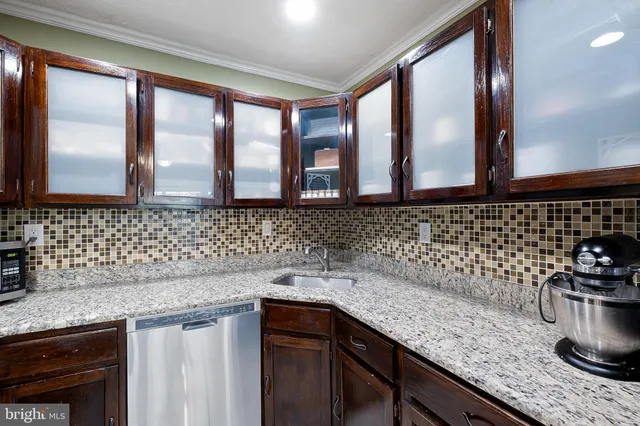 a kitchen with a sink and cabinets