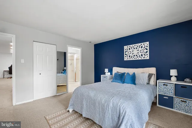 a bedroom with a bed and a table in it