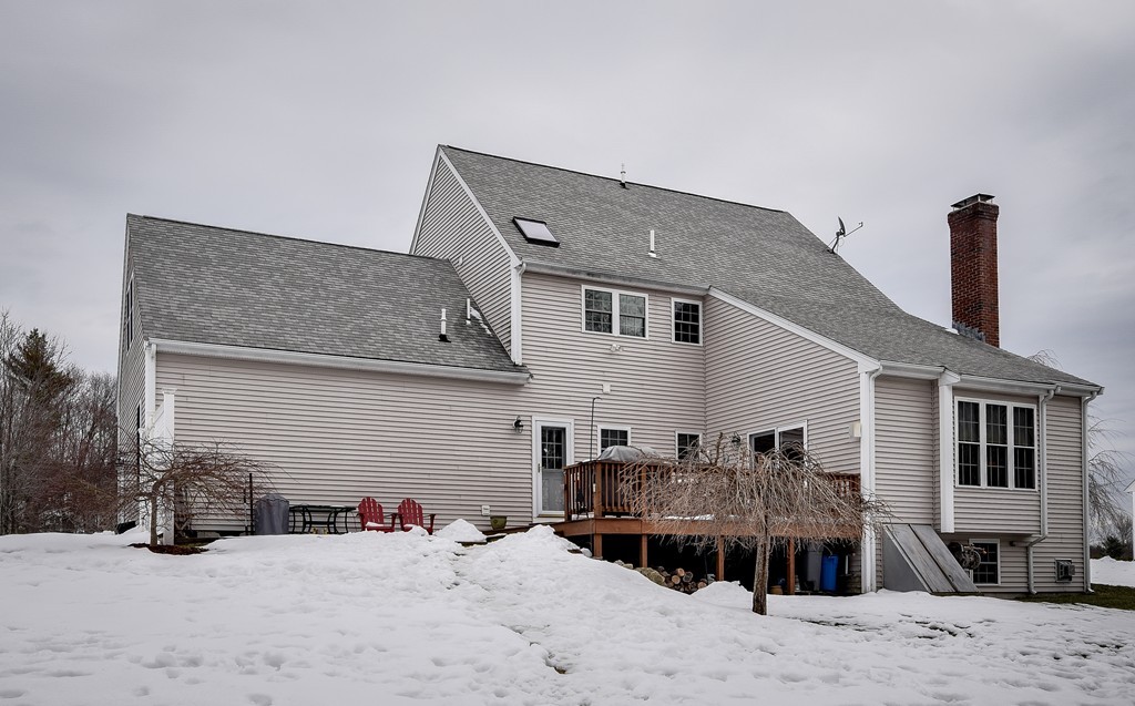 22 Hardwick Road Ashland, MA 01721 - Photo 2 of 24 a view of a house with a barbeque and wooden stairs