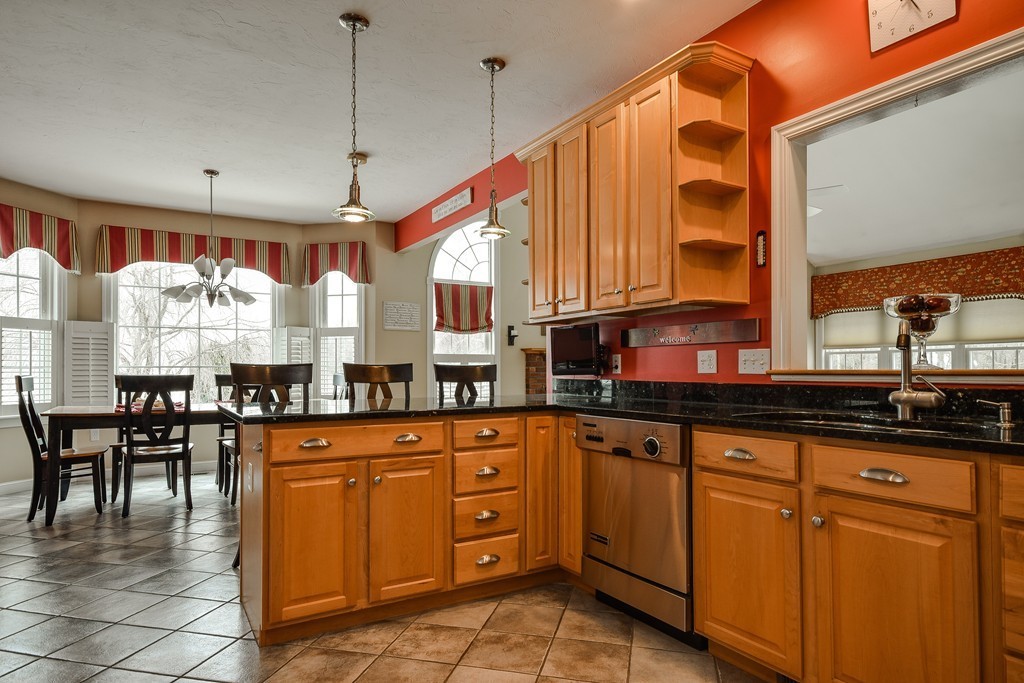 22 Hardwick Road Ashland, MA 01721 - Photo 8 of 24 a kitchen with stainless steel appliances granite countertop a sink and cabinets