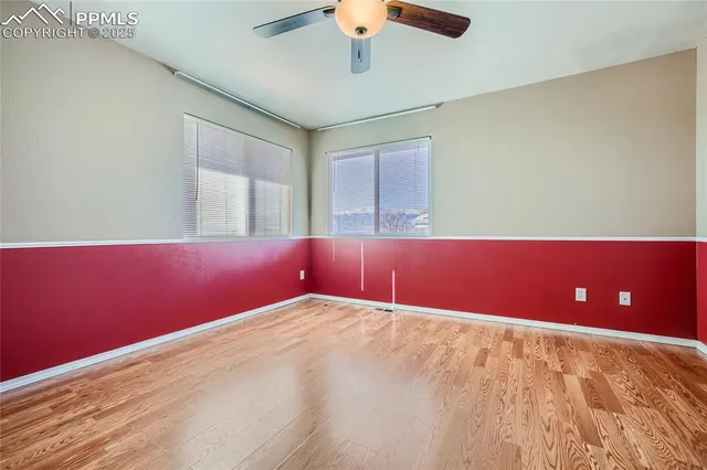 a view of a room with a ceiling fan