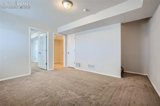 an empty room with closet area