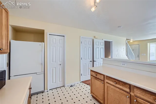a room with a sink and a large mirror