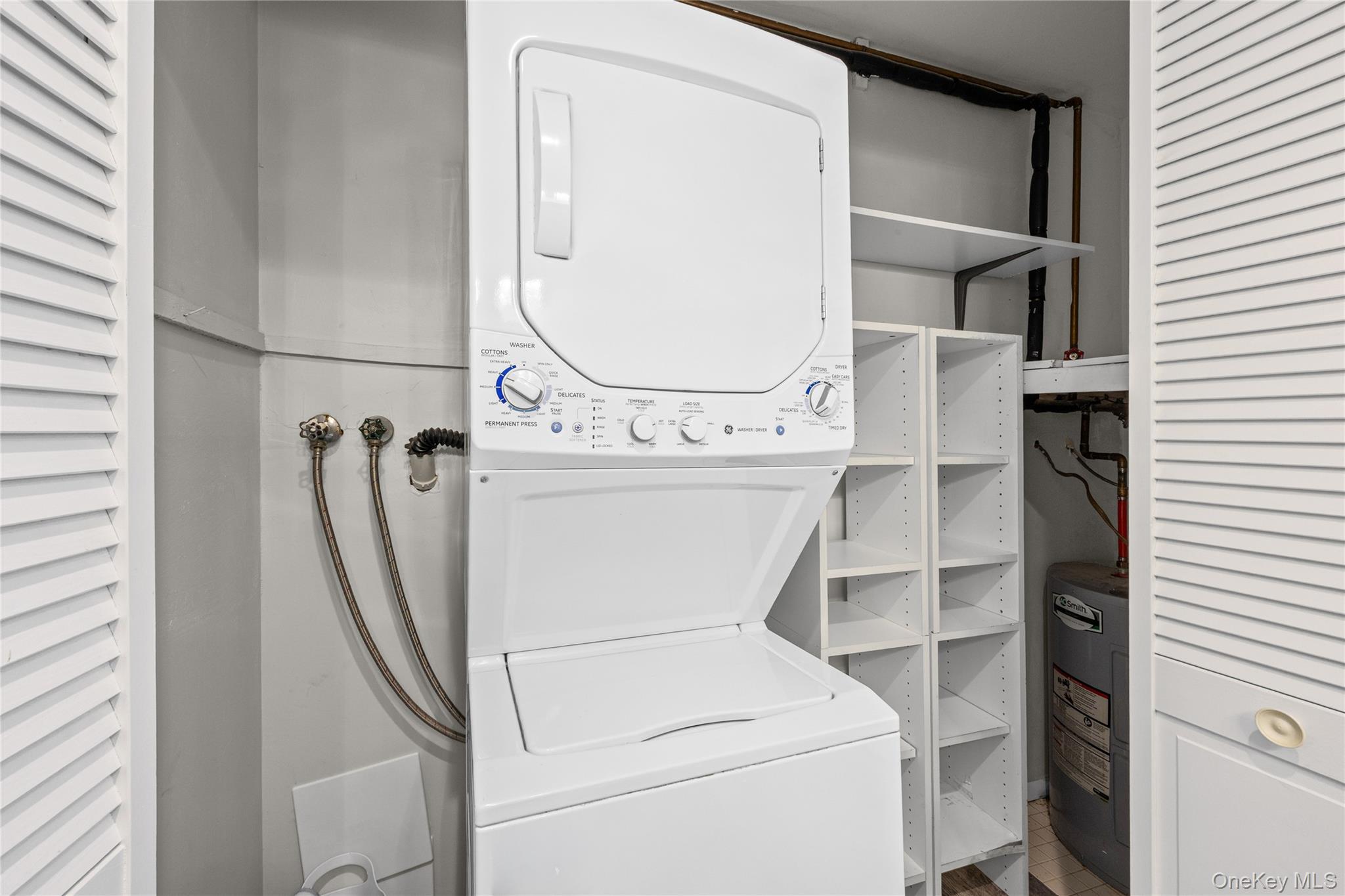 220 Belfast Lane Ridge, NY 11961 - Photo 41 of 44 a utility room with dryer and washer