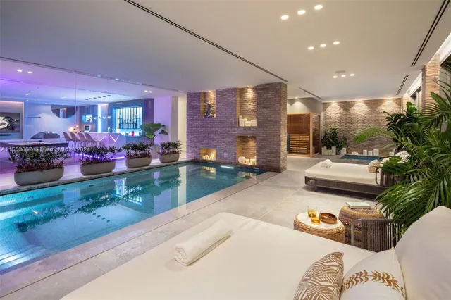 a bedroom with a bed and painting on the wall