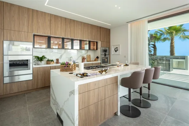 a view of balcony with seating area and barbeque oven