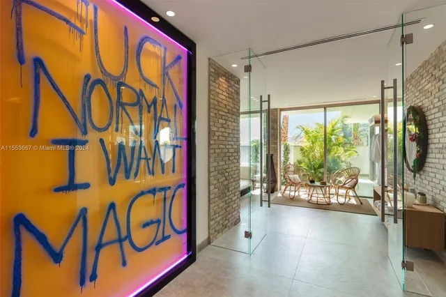 a view of a kitchen with stainless steel appliances granite countertop a sink and cabinets