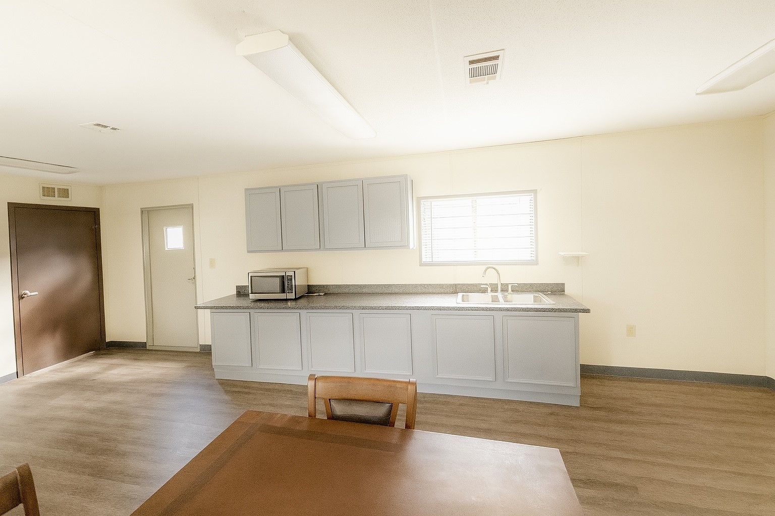 12731 Wanda Way Rosharon, TX 77583 - Photo 2 of 15 a large white kitchen with kitchen island sink stove and white cabinets