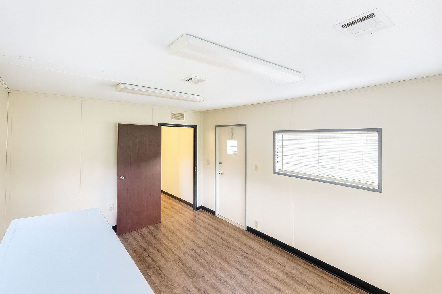 12731 Wanda Way Rosharon, TX 77583 - Photo 8 of 15 a view of an empty room with wooden floor